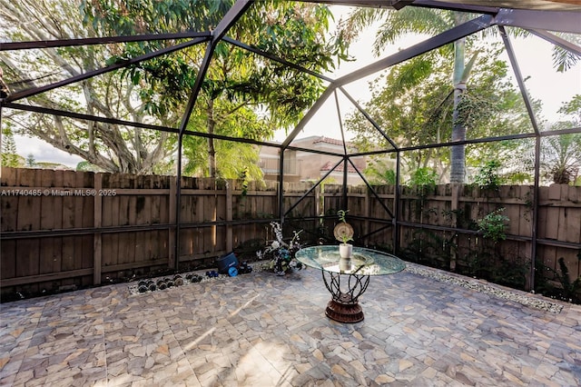 view of patio with a lanai