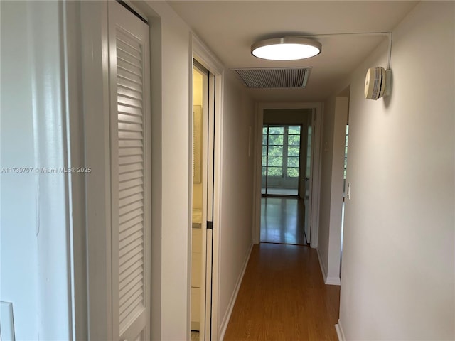 corridor featuring dark wood-type flooring