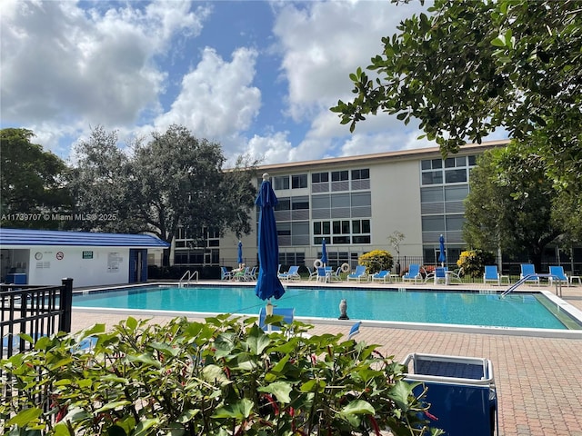 view of pool featuring a patio area