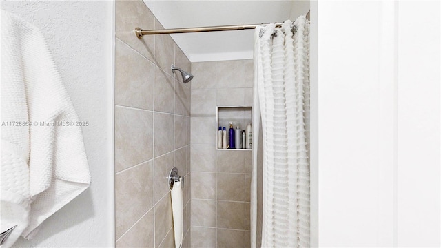 bathroom with a shower with shower curtain