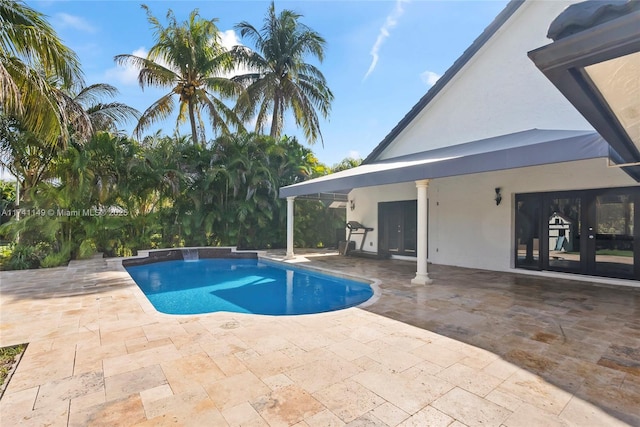 11965 SW 15th Ct, Davie, FL 33325 - swimming pool with french doors and a patio