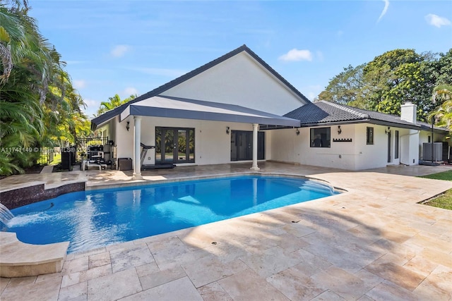 11965 SW 15th Ct, Davie, FL 33325 - outdoor pool featuring french doors and a patio