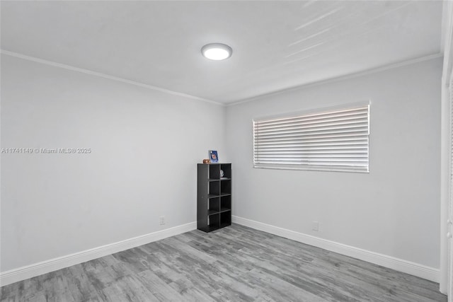 11965 SW 15th Ct, Davie, FL 33325 - unfurnished room with crown molding, wood finished floors, and baseboards