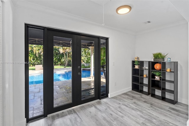 11965 SW 15th Ct, Davie, FL 33325 - entryway featuring french doors, wood finished floors, crown molding, and baseboards