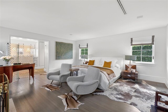 bedroom with hardwood / wood-style flooring