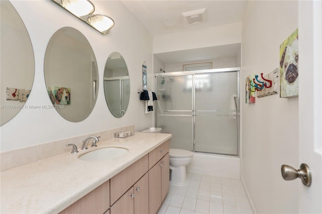 full bath with toilet, enclosed tub / shower combo, vanity, and tile patterned floors