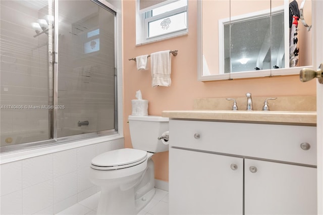 full bathroom with vanity, toilet, tile patterned flooring, and combined bath / shower with glass door