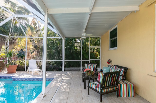 sunroom / solarium featuring ceiling fan