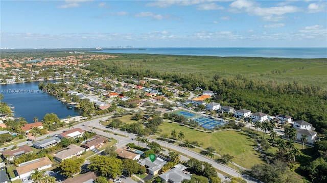 bird's eye view with a water view and a residential view