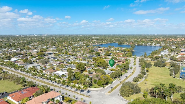 birds eye view of property with a residential view and a water view