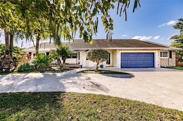 single story home with a garage