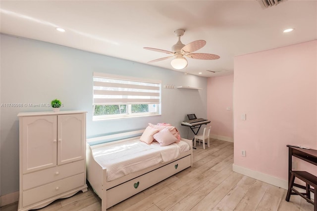 bedroom featuring ceiling fan and light wood-type flooring