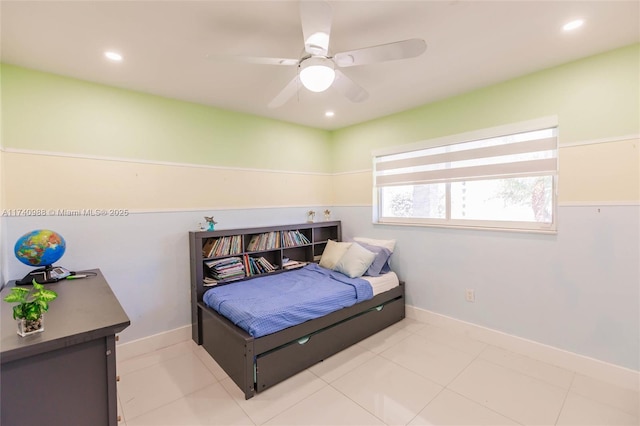 bedroom with ceiling fan and light tile patterned floors