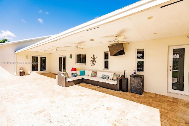 view of patio / terrace with an outdoor hangout area, ceiling fan, and french doors