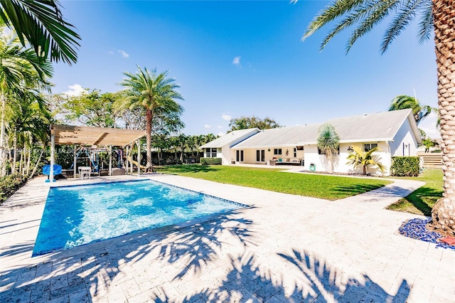 view of swimming pool with a pergola, a patio area, and a lawn