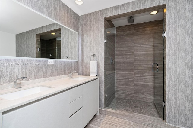 bathroom with vanity and an enclosed shower