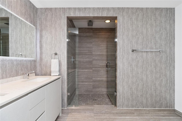 bathroom with vanity and an enclosed shower