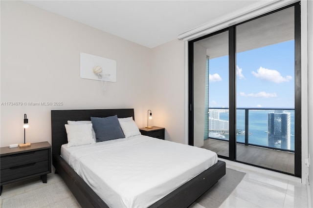 tiled bedroom with floor to ceiling windows, a water view, and access to outside