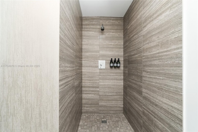 bathroom with tiled shower