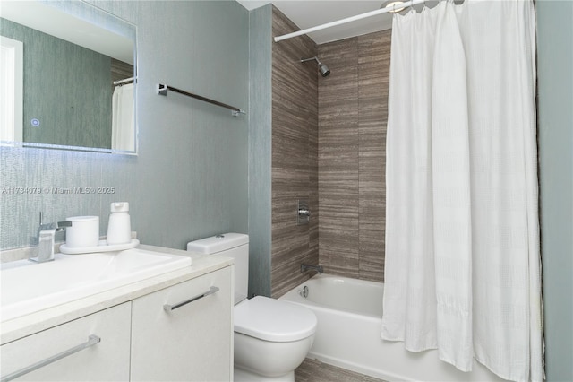 full bathroom featuring shower / tub combo, vanity, and toilet