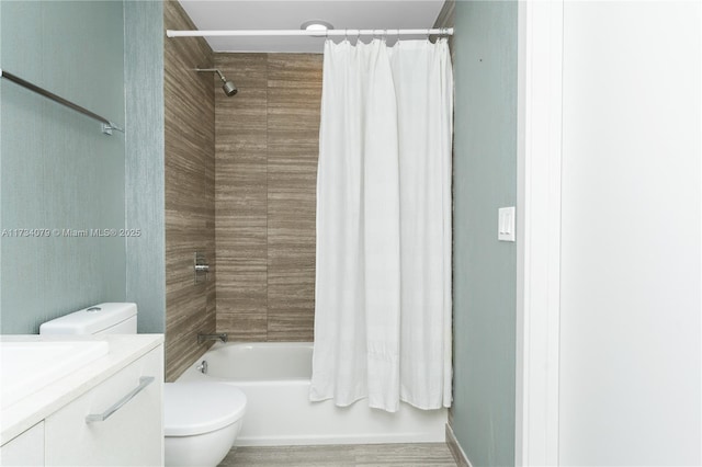 full bathroom featuring shower / tub combo, vanity, and toilet