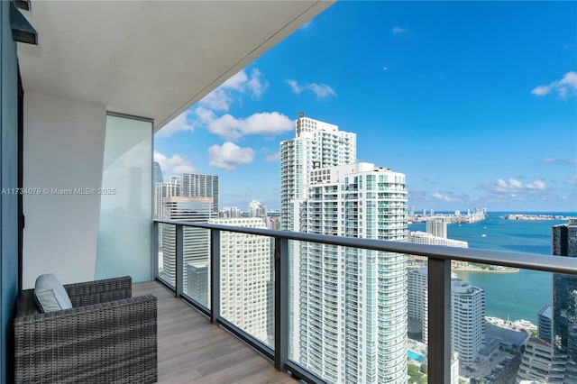 balcony featuring a water view