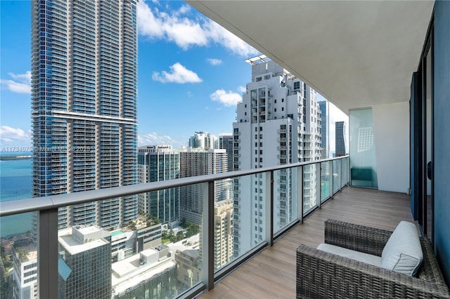 balcony featuring a water view