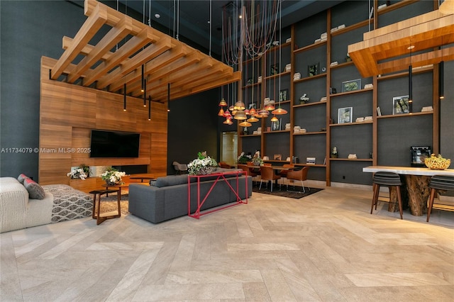 living room with parquet floors and a high ceiling