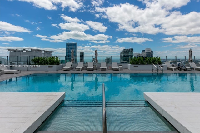 view of swimming pool with a patio