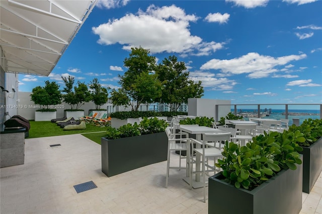 view of patio / terrace featuring a water view