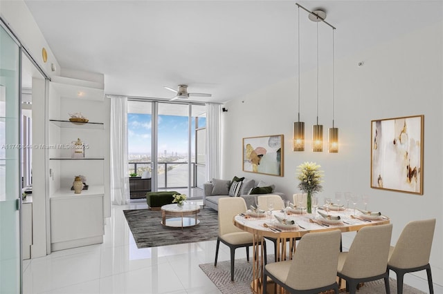 dining room featuring light tile patterned flooring, ceiling fan, and floor to ceiling windows