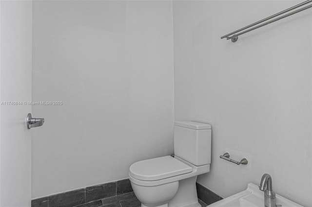 bathroom featuring sink and toilet