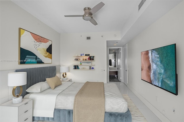 bedroom with ceiling fan and connected bathroom