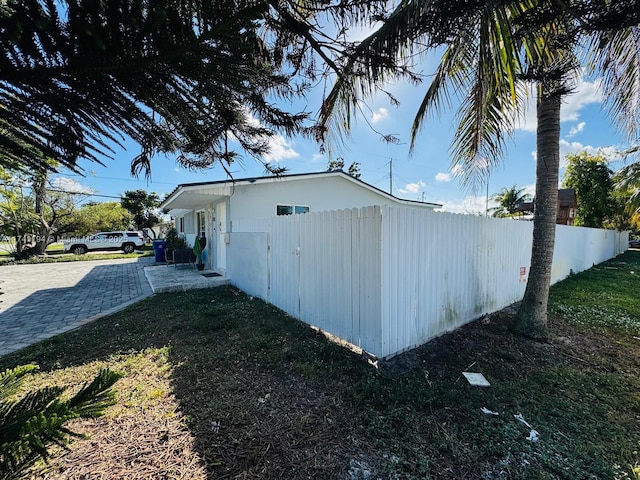 view of property exterior featuring a yard