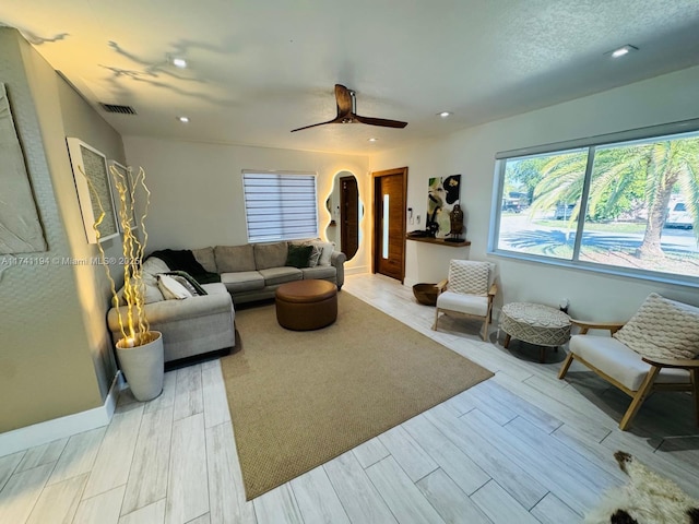 living room featuring ceiling fan