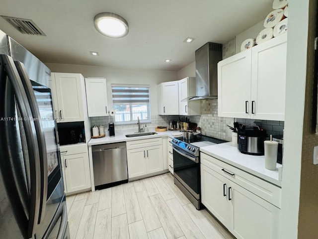 kitchen featuring range with electric cooktop, white cabinetry, dishwasher, and sink