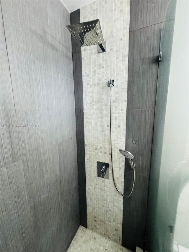 bathroom with a tile shower