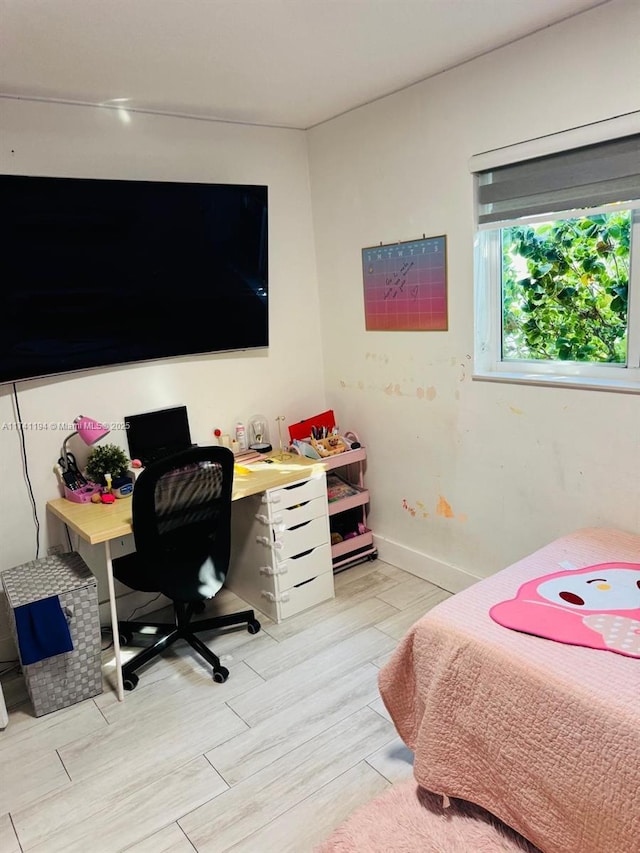 bedroom with light hardwood / wood-style flooring