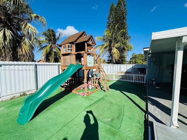 view of playground with a yard