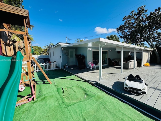 rear view of house with a playground