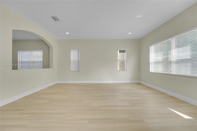 empty room with light hardwood / wood-style floors