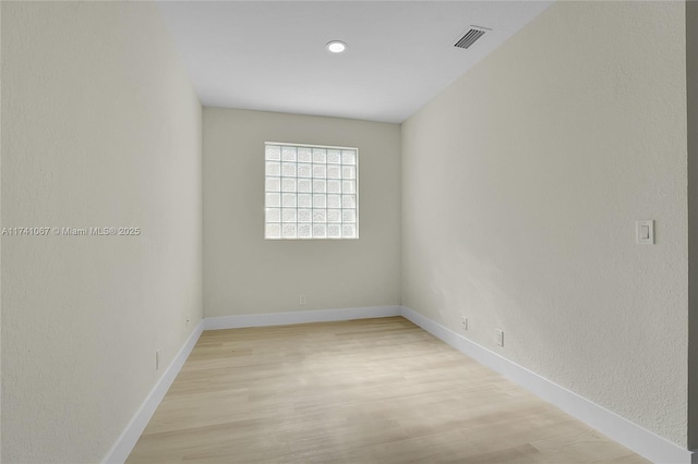 unfurnished room featuring light wood-type flooring