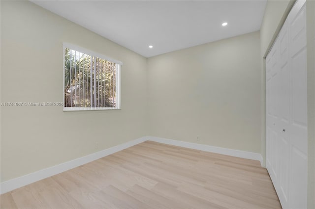 spare room with light hardwood / wood-style floors