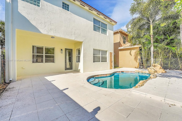 view of pool featuring a patio