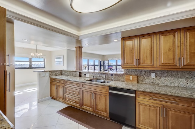 kitchen featuring sink, dishwasher, light stone counters, tasteful backsplash, and light tile patterned flooring