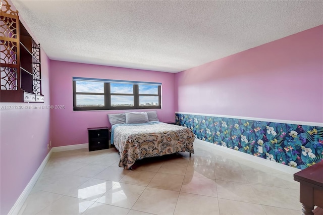 tiled bedroom featuring a textured ceiling