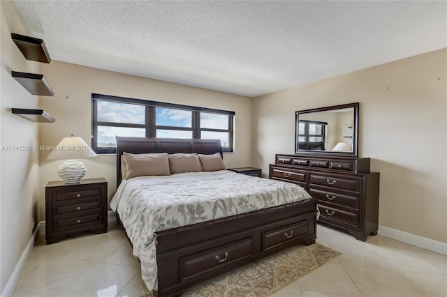 tiled bedroom featuring a textured ceiling