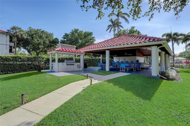 view of yard with a gazebo, area for grilling, a bar, and a patio