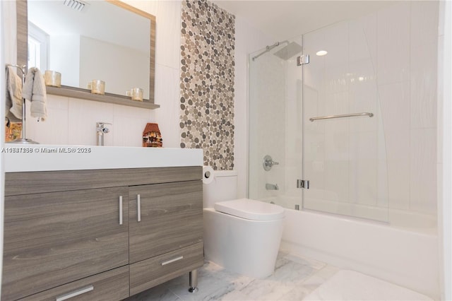 full bathroom with toilet, vanity, and shower / bath combination with glass door