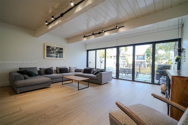 living room featuring wood ceiling, light hardwood / wood-style floors, rail lighting, and beamed ceiling